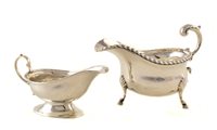 Lot 31 - Silver sauce-boat, traditional three legged form, scroll handle with acanthus leaf decoration, rope twist border, hallmarked Birmingham, 1930, weight approximately 7ozt, together with a small silve...