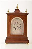 Lot 352 - A 20th century mahogany mantel clock with French made movement.