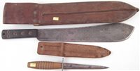 Lot 169 - A commando knife and a machete