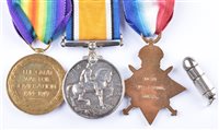 Lot 37 - A World War One trio of medals awarded to 14559 PTE. T. BROWN CHES. R. and a pendant of a bullet.