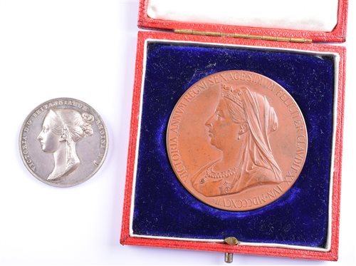 Lot 1 - Queen Victoria 1838 Coronation silver medal and Queen Victoria Diamond Jubilee 1897 bronze medal, cased (2).