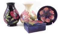 Lot 222 - Two Moorcroft vases, small bowl and a box.