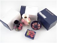 Lot 222 - Two Moorcroft vases, small bowl and a box.