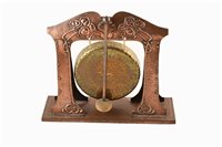 Lot 11 - An Arts & Crafts movement copper and brass dinner gong