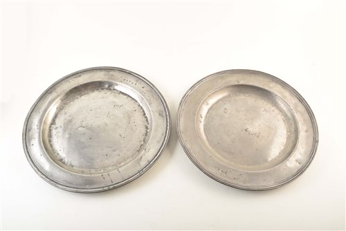 Lot 34 - Two 18th century pewter chargers. With unidentified touch marks to rim. 42 and 43cm diameter.