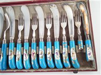 Lot 220 - A cased set of porcelain knives and forks
