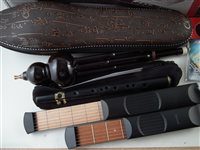 Lot 156 - A collection of musical instruments and related items to include a Koreen electric violin in case, Akai Ewi USB wind instrument, two Asian wind instruments and various accessories