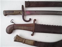 Lot 170 - Russian saw back pioneers short sword, Chassepot bayonet and scabbard and a kukri
