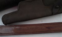 Lot 81 - A collection of five holsters, arrow quiver, case of Victorian shop display revolvers and whip