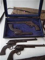 Lot 81 - A collection of five holsters, arrow quiver, case of Victorian shop display revolvers and whip