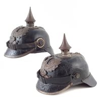 Lot 38 - Two Pickelhaube helmets.