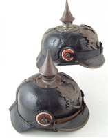 Lot 38 - Two Pickelhaube helmets.