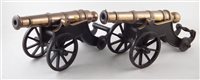 Lot 18 - Two similar bronze model cannons on cast iron bases