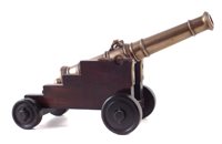Lot 12 - 19th century bronze model cannon on naval base