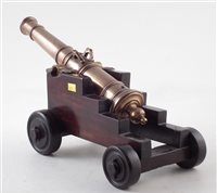 Lot 12 - 19th century bronze model cannon on naval base