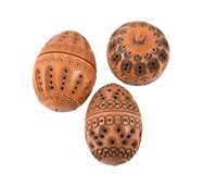Lot 147 - Three pierced and carved coquilla nuts