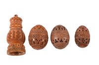 Lot 15 - Four pierced and carved coquilla nuts.