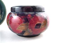 Lot 233 - Moorcroft pomegranate box, two bowls , two mugs and an enamels box also a Dennis vase