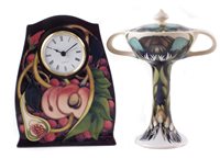 Lot 250 - Moorcroft clock and lidded vase