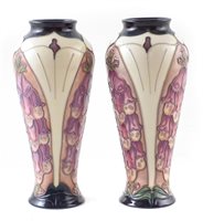 Lot 257 - A pair of Moorcroft vases decorated with foxgloves pattern