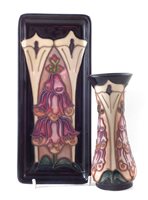 Lot 247 - Moorcroft vase and small tray decorated with foxgloves pattern