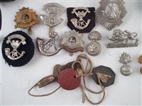 Lot 26 - Collection of buttons, cap badges, shoulder titles, US Leather Holster etc