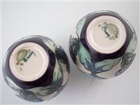 Lot 245 - Matched pair of Moorcroft vases, decorated with blue as the sky pattern (2) 13cm high
