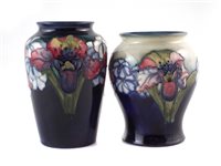 Lot 286 - Two Moorcroft orchid pattern vases, the tallest stands 15cm high