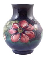 Lot 299 - Moorcroft clematis pattern vase, 19cm high