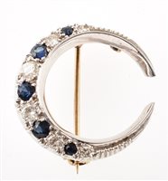 Lot 33 - Sapphire and diamond white gold crescent brooch