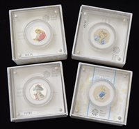 Lot 94 - Four Royal Mint Beatrix Potter 50p Silver Proof Coloured Coins, 2017.