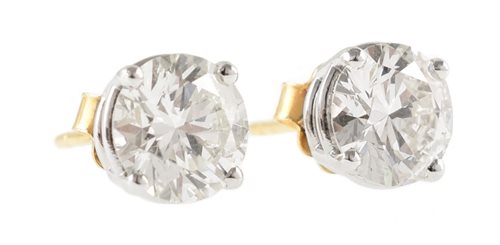 54 - Pair of diamond solitaire 18ct gold stud earrings