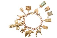 Lot 27 - 9ct gold charm bracelet with assorted charms