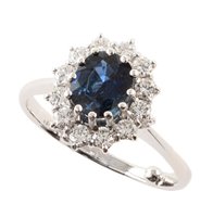 Lot 89 - Sapphire and diamond 18ct white gold cluster ring