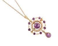 Lot 62 - Edwardian amethyst and seed pearl 15ct gold drop pendant brooch and chain